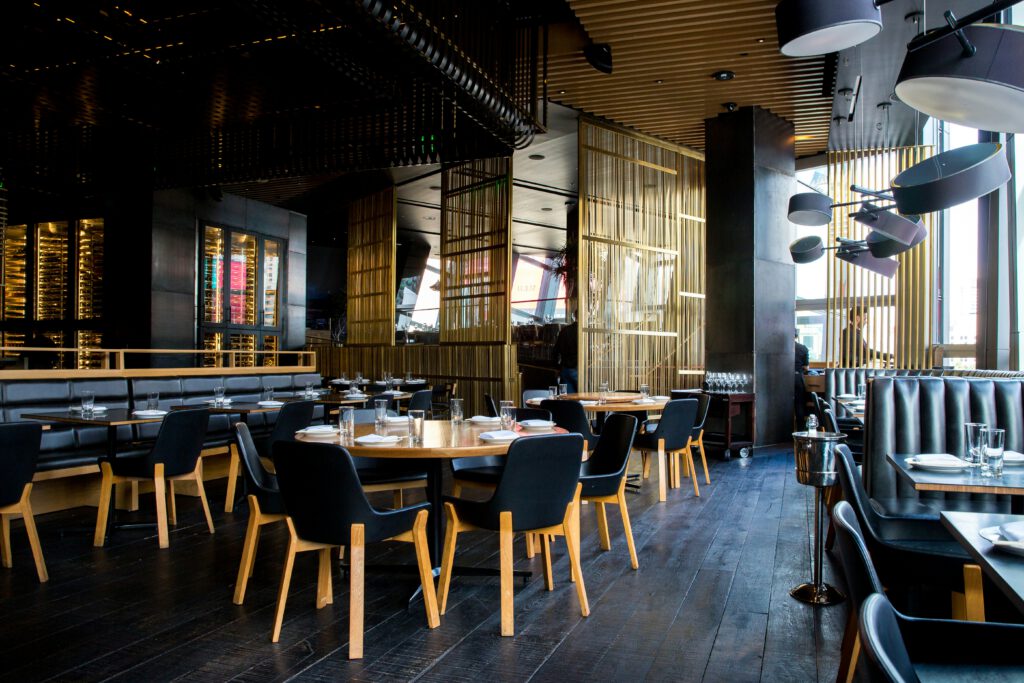 Restaurants in Hua Hin Thailand showing a French bistro interior with arched windows and white tablecloths